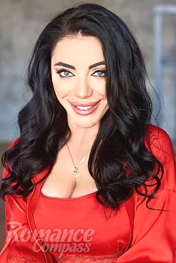 Ukrainian mail order bride Evgenia from Kyiv with black hair and green eye color - image 1