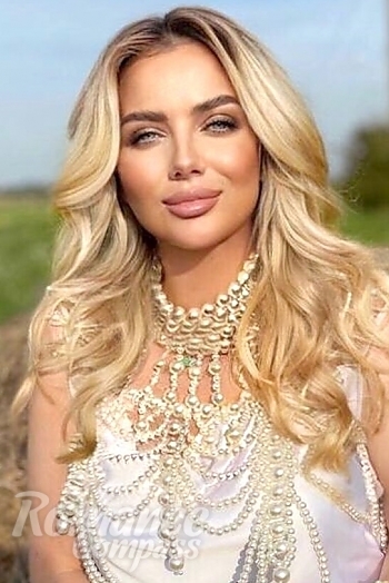 Ukrainian mail order bride Oksana from Kiev with blonde hair and blue eye color - image 1