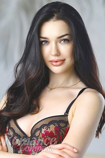 Ukrainian mail order bride Yuliia from Kiev with black hair and green eye color - image 1