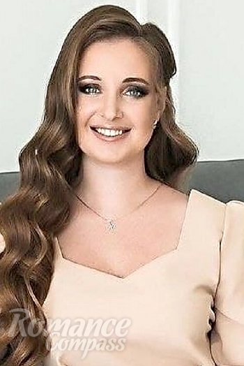 Ukrainian mail order bride Yuliya from Minsk with brunette hair and blue eye color - image 1