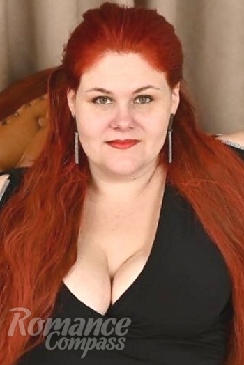 Ukrainian mail order bride Maryna from Odessa with red hair and green eye color - image 1
