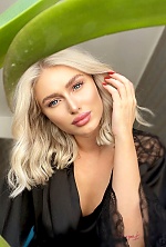 Ukrainian mail order bride Ilinca from Bucharest with blonde hair and blue eye color - image 13