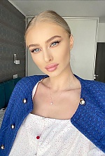 Ukrainian mail order bride Ilinca from Bucharest with blonde hair and blue eye color - image 12