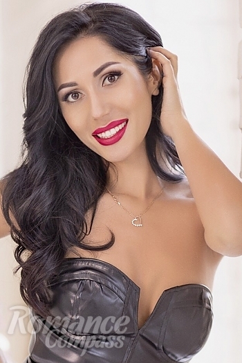 Ukrainian mail order bride Ester from Kyiv with black hair and hazel eye color - image 1