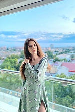 Ukrainian mail order bride Ksenia from Kyiv with light brown hair and hazel eye color - image 3