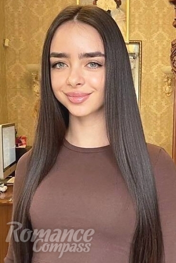 Ukrainian mail order bride Kristina from Kiev with black hair and green eye color - image 1