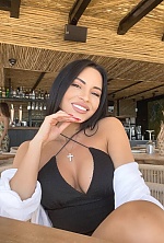 Ukrainian mail order bride Oksana from Kiev with black hair and brown eye color - image 8
