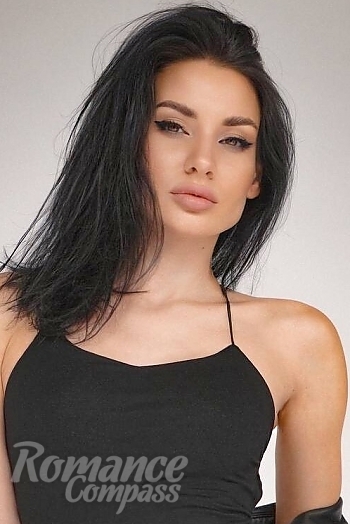 Ukrainian mail order bride Julia from Kiev with black hair and green eye color - image 1
