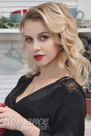 Ukrainian mail order bride Olga from Kiev with blonde hair and green eye color - image 1
