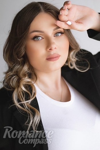 Ukrainian mail order bride Anna from Nikolaev with light brown hair and blue eye color - image 1