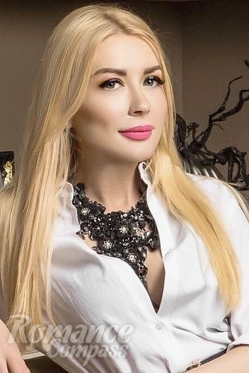 Ukrainian mail order bride Olena from Kiev with blonde hair and green eye color - image 1