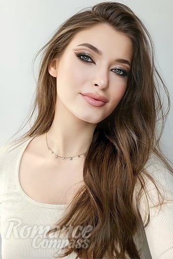 Ukrainian mail order bride Luiza from Zhytomyr with light brown hair and blue eye color - image 1