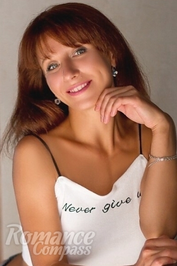 Ukrainian mail order bride Anna from Lugansk with red hair and green eye color - image 1