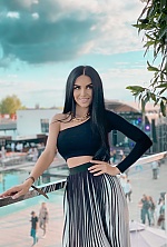Ukrainian mail order bride Olga from Kyiv with black hair and green eye color - image 10