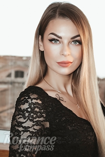 Ukrainian mail order bride Irina from Poltava with light brown hair and blue eye color - image 1