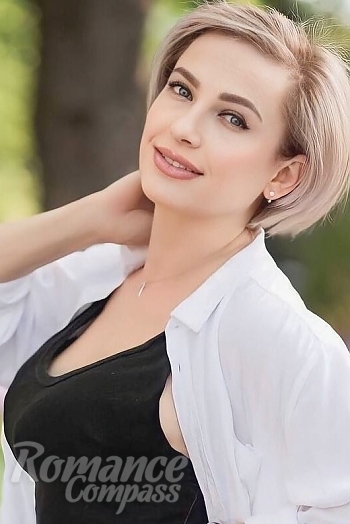 Ukrainian mail order bride Olga from Odessa with blonde hair and blue eye color - image 1
