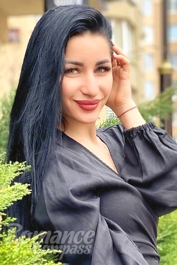 Ukrainian mail order bride Ekaterina from Kiev with black hair and green eye color - image 1