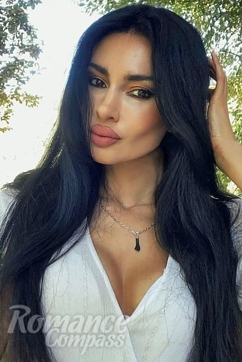 Ukrainian mail order bride Christina from Oviedo with black hair and brown eye color - image 1