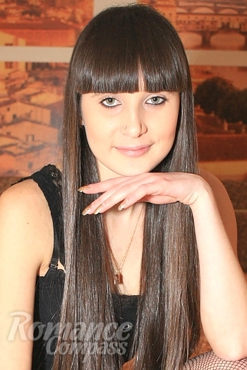 Ukrainian mail order bride Svetlana from Kherson with black hair and green eye color - image 1