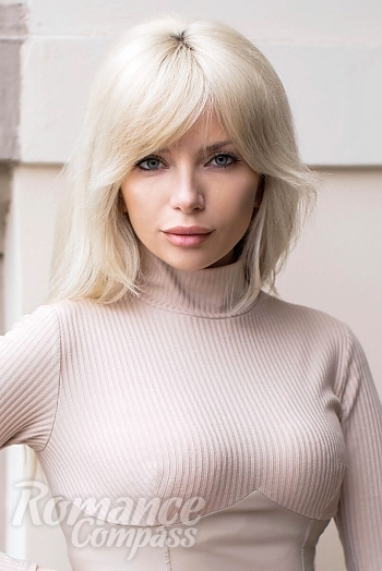 Ukrainian mail order bride Yulia from Kiev with blonde hair and blue eye color - image 1