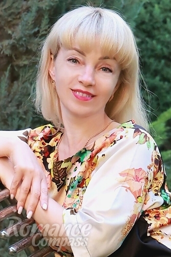 Ukrainian mail order bride Olga from Khmelnytskyi with blonde hair and blue eye color - image 1