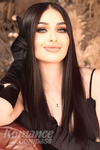 Ukrainian mail order bride Anastasia from Kharkiv with black hair and green eye color - image 1