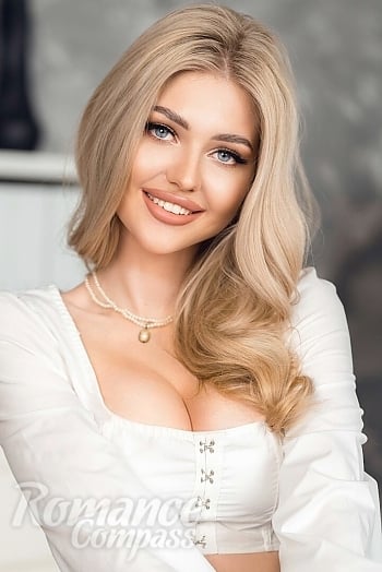Ukrainian mail order bride Alina from Kiev with blonde hair and blue eye color - image 1