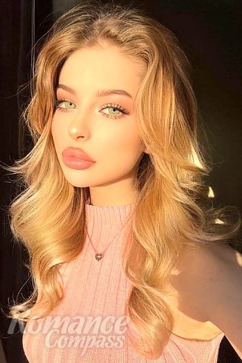 Ukrainian mail order bride Tanya from Minsk with blonde hair and green eye color - image 1