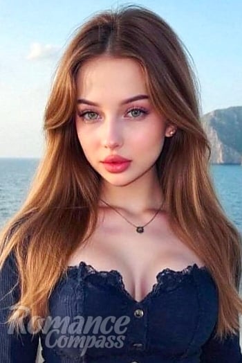 Ukrainian mail order bride Tanya from Minsk with blonde hair and green eye color - image 1