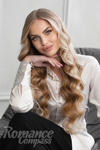 Ukrainian mail order bride Polina from Kiev with blonde hair and blue eye color - image 1