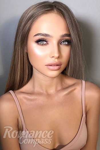 Ukrainian mail order bride Vlada from Kharkiv with light brown hair and green eye color - image 1