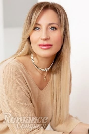 Ukrainian mail order bride Oksana from Kyiv with blonde hair and grey eye color - image 1