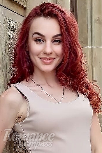 Ukrainian mail order bride Yulia from Warsaw with red hair and green eye color - image 1