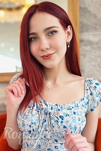 Ukrainian mail order bride Oksana from Cherkasy with red hair and green eye color - image 1