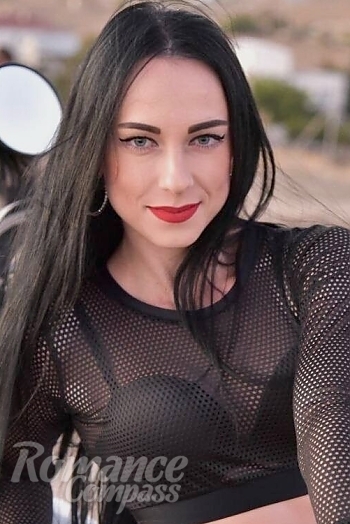 Ukrainian mail order bride Victoria from Kiev with black hair and green eye color - image 1