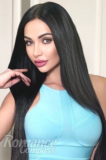 Ukrainian mail order bride Diana from Kyiv with black hair and green eye color - image 1