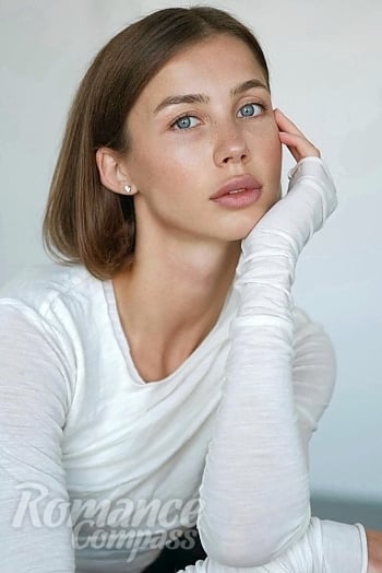 Ukrainian mail order bride Yanina from Kiev with light brown hair and blue eye color - image 1