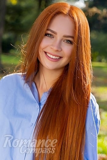 Ukrainian mail order bride Anastasiia from Kyiv with red hair and green eye color - image 1