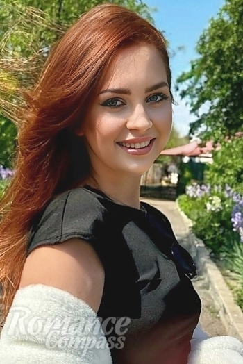 Ukrainian mail order bride Anastasiia from Kyiv with red hair and green eye color - image 1