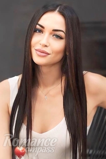 Ukrainian mail order bride Julia from Kyiv with black hair and green eye color - image 1