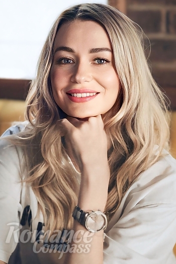 Ukrainian mail order bride Nataliia from Madrid with blonde hair and blue eye color - image 1