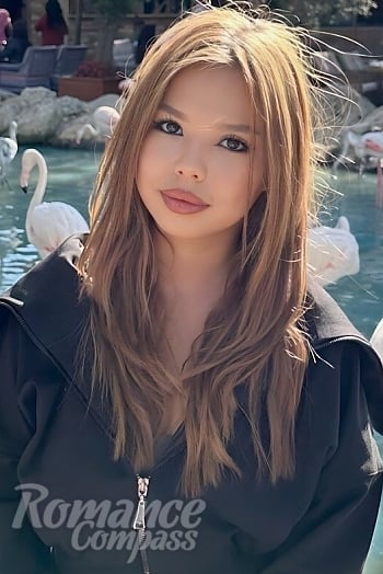 Ukrainian mail order bride Meruyert from Astana with light brown hair and brown eye color - image 1