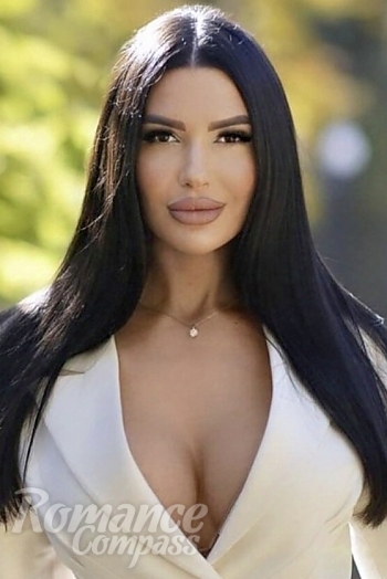 Ukrainian mail order bride Victoria from Kherson with black hair and green eye color - image 1