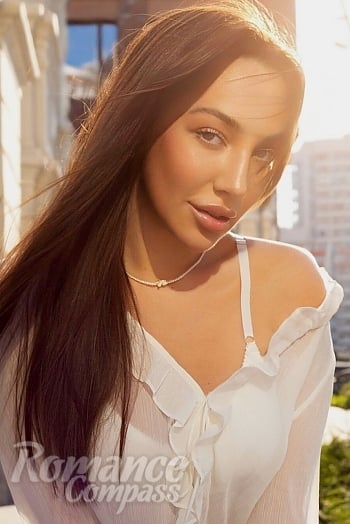 Ukrainian mail order bride Mariia from Warsaw with brunette hair and blue eye color - image 1