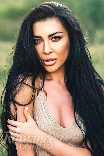 Ukrainian mail order bride Oksana from Kharkiv with brunette hair and blue eye color - image 1