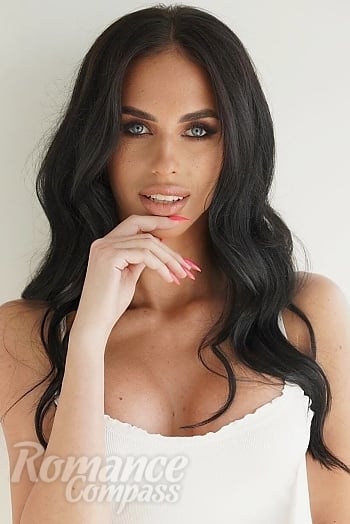 Ukrainian mail order bride Anastasia from Kyiv with black hair and blue eye color - image 1