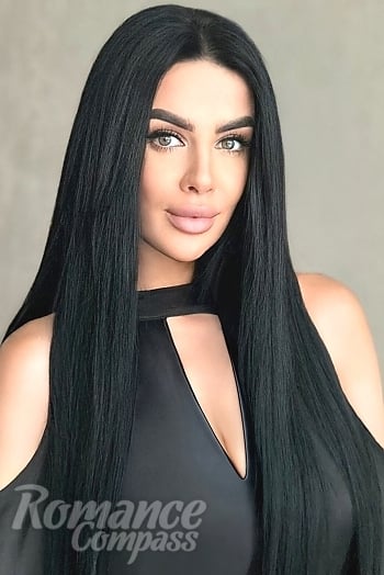 Ukrainian mail order bride Dana from Kyiv with black hair and green eye color - image 1