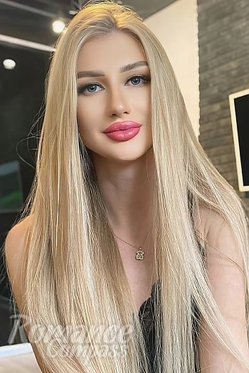 Ukrainian mail order bride Yana from Warsaw with blonde hair and blue eye color - image 1