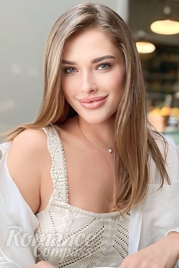 Ukrainian mail order bride Viktoriia from Milan with light brown hair and blue eye color - image 1