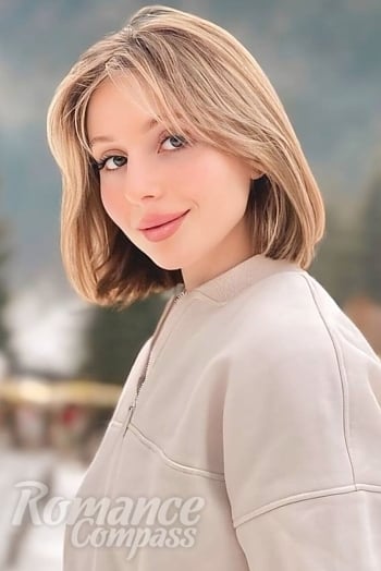 Ukrainian mail order bride Anastasiia from Kyiv with light brown hair and blue eye color - image 1